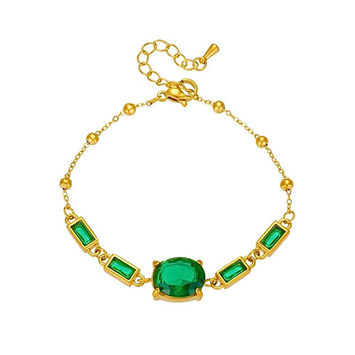 racelet Selkis
Élégance et puissance se rencontrent dans le Bracelet Selkis, conçu en acier inoxydable doré pour traverser le temps sans s’altérer. Ses pierres vert émeraude facettées illuminent le poignet et rappellent les trésors sacrés de l’Égypte antique.

La finition raffinée se distingue par une petite languette discrète, gravée au nom de la marque, qui signe ce bijou comme une création exclusive et intemporelle.
Un bracelet talisman, pensé pour accompagner chaque geste d’assurance et de gr